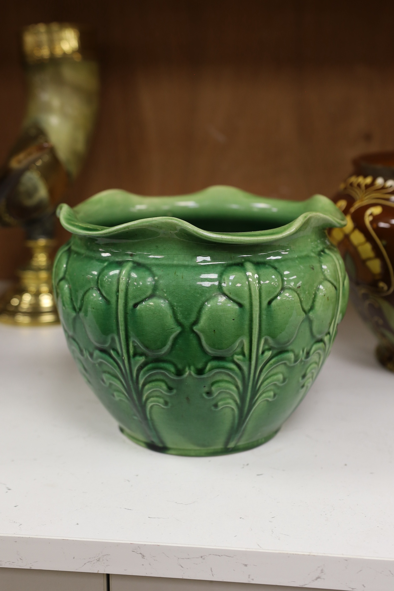 A Wardle decorative Arts and Crafts pottery jardiniere together with a green glazed jardiniere (2). Condition - fair